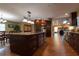 Spacious open kitchen and dining area featuring dark wood cabinets and stainless steel appliances at 7550 Jomel Dr, Weeki Wachee, FL 34607