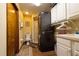 This laundry room with combined washer and dryer is conveniently located near a bathroom at 7550 Jomel Dr, Weeki Wachee, FL 34607