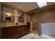 This bathroom has granite countertops, double sinks, glass bowl sinks, and a walk-in tub/shower at 7550 Jomel Dr, Weeki Wachee, FL 34607
