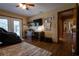 Functional office space with desk, built-in shelving, and a cozy massage chair near French doors at 7550 Jomel Dr, Weeki Wachee, FL 34607