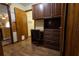Home office features custom cabinetry, a built-in desk, and ample storage for a productive workspace at 7550 Jomel Dr, Weeki Wachee, FL 34607