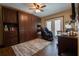 Dedicated office space with a built-in desk, custom cabinetry, and a relaxing massage chair at 7550 Jomel Dr, Weeki Wachee, FL 34607