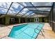 Enjoy the screened-in pool area with ample brick patio space for entertaining at 7550 Jomel Dr, Weeki Wachee, FL 34607