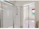 This bathroom features a glass shower with a shower head at 758 Alpine Thistle Dr, Brooksville, FL 34604