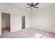 Spacious bedroom features plush carpet and a ceiling fan at 758 Alpine Thistle Dr, Brooksville, FL 34604