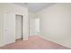 This carpeted bedroom features a closet with a double door at 758 Alpine Thistle Dr, Brooksville, FL 34604
