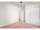 Carpeted bedroom featuring a closet and doorway at 758 Alpine Thistle Dr, Brooksville, FL 34604