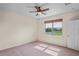 This bedroom has neutral paint and a ceiling fan at 758 Alpine Thistle Dr, Brooksville, FL 34604