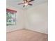Bedroom with carpeting and a window offering natural light at 758 Alpine Thistle Dr, Brooksville, FL 34604
