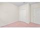 Bright bedroom featuring a double-door closet and neutral walls at 758 Alpine Thistle Dr, Brooksville, FL 34604