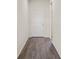 Hallway featuring hardwood flooring with white doors at 758 Alpine Thistle Dr, Brooksville, FL 34604