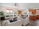 Bright, open-concept living space with modern furnishings, and adjacent dining area at 758 Alpine Thistle Dr, Brooksville, FL 34604