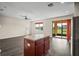 Open layout showing the living area and kitchen with a sliding door to a screened patio at 758 Alpine Thistle Dr, Brooksville, FL 34604