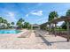 Resort-style pool area with lounge chairs and a pergola, perfect for relaxing and enjoying the sun at 758 Alpine Thistle Dr, Brooksville, FL 34604