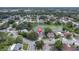 A charming home near a pond in a quiet neighborhood, showcased in an aerial view at 7701 Anaheim Ave, New Port Richey, FL 34655