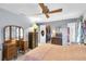 Bedroom with vanity, mirror, closet and private bathroom entrance at 7701 Anaheim Ave, New Port Richey, FL 34655