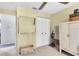 Bright bedroom with closet, decorative basket, and storage cabinet at 7701 Anaheim Ave, New Port Richey, FL 34655
