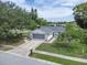 Well-maintained home with a two-car garage and a manicured lawn at 7701 Anaheim Ave, New Port Richey, FL 34655
