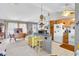 Cozy kitchen with vintage accents and an open layout, seamlessly connecting to the dining and living areas for easy flow at 7701 Anaheim Ave, New Port Richey, FL 34655