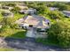 Birds-eye view of house, driveway, and landscaped lawn in a quiet neighborhood at 8130 Bugle Ct # 3, Port Richey, FL 34668