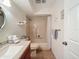 Neutral-toned bathroom with a shower-tub combo, and a single vanity with ample counter space at 8130 Bugle Ct # 3, Port Richey, FL 34668