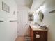 Functional bathroom with a single vanity and a shower-tub combo; bright overhead lighting at 8130 Bugle Ct # 3, Port Richey, FL 34668