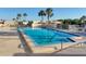 Gorgeous community pool with clear blue water and ample seating for sunbathing at 8130 Bugle Ct # 3, Port Richey, FL 34668