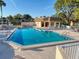 Inviting community pool featuring a covered cabana and ample seating for relaxation at 8130 Bugle Ct # 3, Port Richey, FL 34668