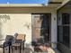 Covered front door and seating area, providing curb appeal and welcome at 8130 Bugle Ct # 3, Port Richey, FL 34668