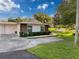 Inviting home featuring a well-maintained front lawn and charming curb appeal at 8130 Bugle Ct # 3, Port Richey, FL 34668