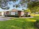 Well-kept home with mature landscaping and a screened-in lanai at 8130 Bugle Ct # 3, Port Richey, FL 34668