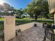 Charming front porch with patio seating overlooking manicured lawn and mature trees at 8130 Bugle Ct # 3, Port Richey, FL 34668