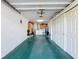 Spacious garage with storage, bright lighting, and updated floors at 8130 Bugle Ct # 3, Port Richey, FL 34668