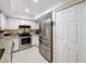 Kitchen featuring stainless steel appliances and lots of cabinet storage space at 8130 Bugle Ct # 3, Port Richey, FL 34668