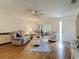 Comfortable living room with plush seating, ceiling fan, and access to a sunroom at 8130 Bugle Ct # 3, Port Richey, FL 34668