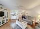 Open floorplan of living room flowing into dining area, perfect for entertaining at 8130 Bugle Ct # 3, Port Richey, FL 34668