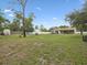 Spacious yard with trampoline, swing set, storage shed, and gazebo at 8324 Nightingale Rd, Weeki Wachee, FL 34613