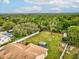 Aerial view of the backyard highlighting the fire pit, gazebo with seating, and a play area, perfect for relaxation at 8324 Nightingale Rd, Weeki Wachee, FL 34613