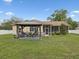 This expansive backyard features an outdoor kitchen, gazebo, and screened in patio at 8324 Nightingale Rd, Weeki Wachee, FL 34613
