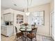 Cozy dining area with a round table, elegant chairs, decorative niche and abundant natural light at 8324 Nightingale Rd, Weeki Wachee, FL 34613