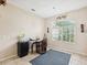 Bright office space with a large window and tile flooring, perfect for a home office or study at 8324 Nightingale Rd, Weeki Wachee, FL 34613
