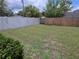 Fenced backyard with a grass lawn at 9056 Horizon Dr, Spring Hill, FL 34608