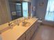 Bathroom featuring a long vanity, updated mirror and fixtures, and nice color scheme at 9056 Horizon Dr, Spring Hill, FL 34608