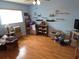 Spacious bedroom with wood flooring, large windows, and ample space for customization at 9056 Horizon Dr, Spring Hill, FL 34608