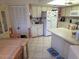 Bright kitchen with ample cabinet and counter space, updated appliances, and tiled floors at 9056 Horizon Dr, Spring Hill, FL 34608