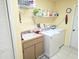 Laundry room featuring a sink, washer, and dryer, ensuring efficiency in chores at 9056 Horizon Dr, Spring Hill, FL 34608