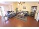 Inviting living room featuring wood floors, comfortable seating, and a relaxed atmosphere at 9056 Horizon Dr, Spring Hill, FL 34608