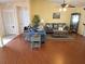 Inviting living room featuring wood floors, comfortable seating, and a relaxed atmosphere at 9056 Horizon Dr, Spring Hill, FL 34608