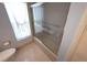 Bathroom featuring tiled shower with glass doors at 9056 Horizon Dr, Spring Hill, FL 34608
