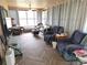Spacious sunroom with tile flooring and comfortable seating area at 9056 Horizon Dr, Spring Hill, FL 34608